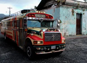 A bright red chicken bus in Antigua, Guatemala