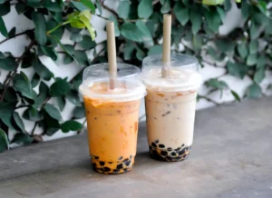 Two plastic cups of bubble tea boba in a shop in London