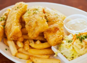 British Fish and Chips on a plate in a pub