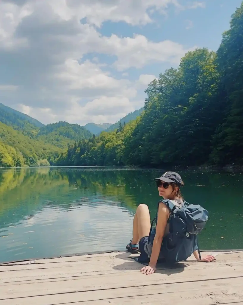 Laura sat at a lake in Biogradska Gora National Park