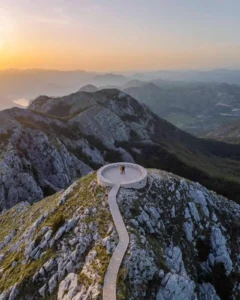 A drone shot of Lauz Explores at a viewpoint called Njegos Mausoleum in Montenegro