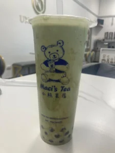 A cup of green bubble tea with tapioca pearls from Maci's Tea in Budapest