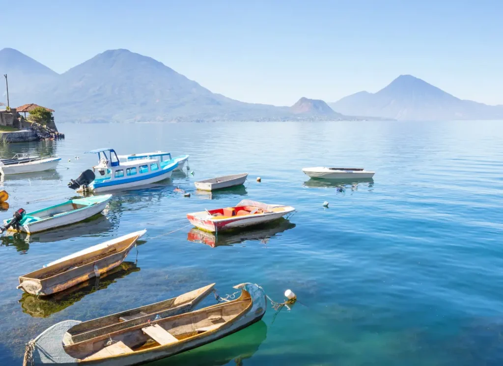 a group of boats on Lake Atitlan on the shores of San Marcos