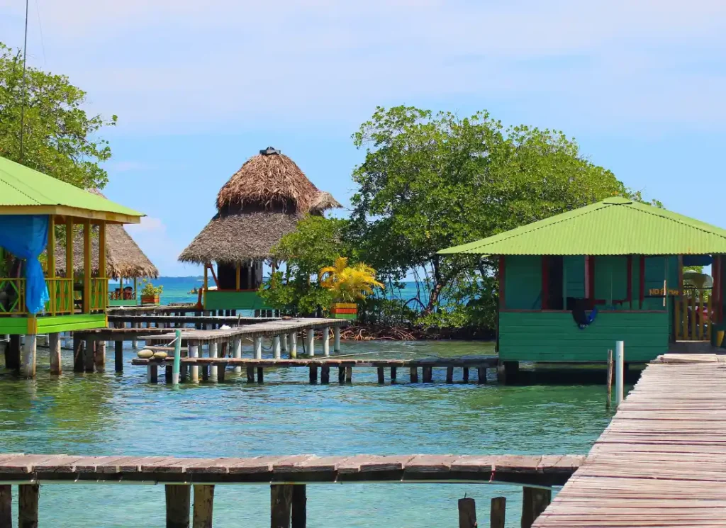 Three houses connected by thin walkways over the water on the islands in Bocas del Toro, Panama