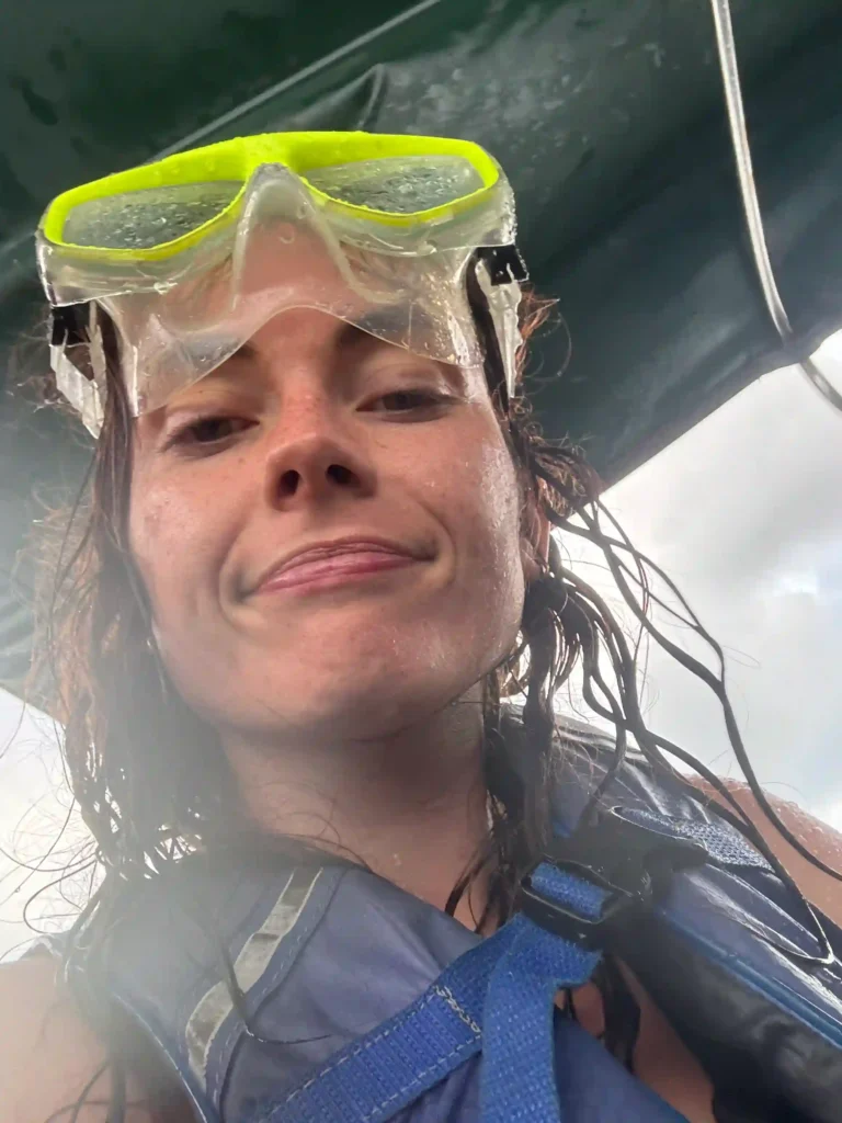 me wearing a snorkel masking getting soaked on a boat