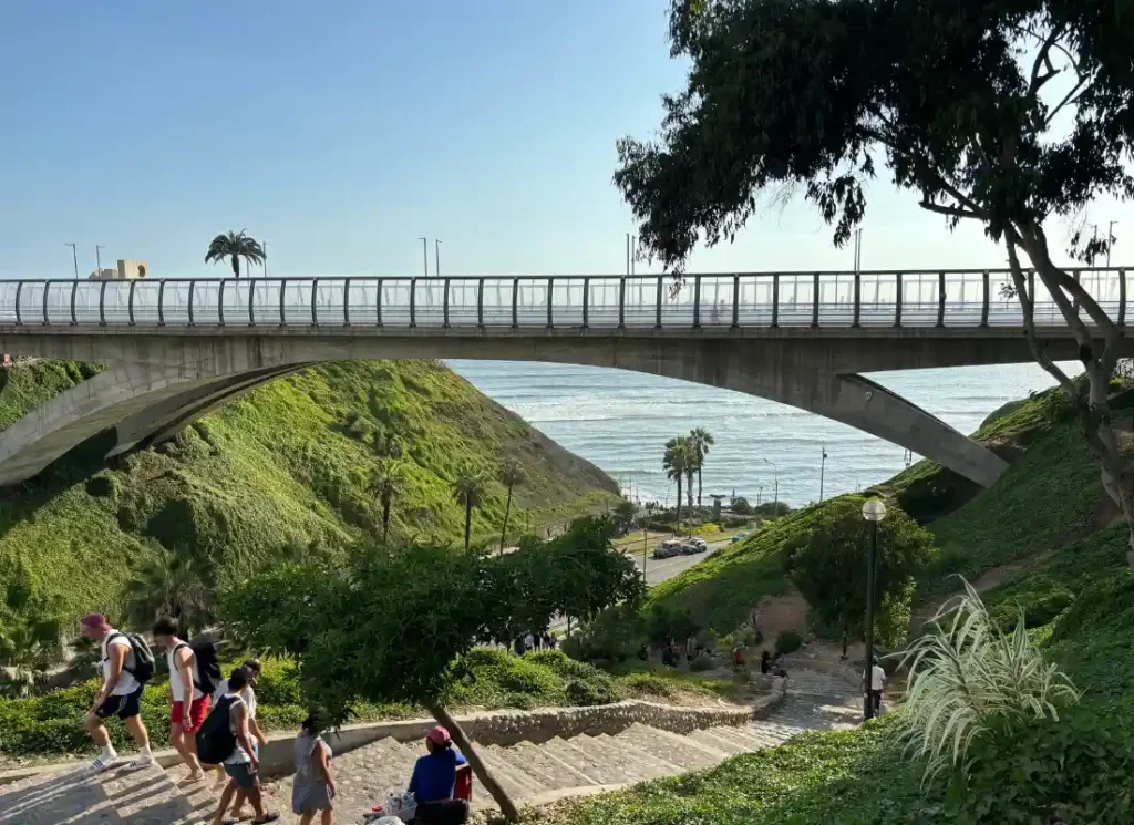 A bridge spanning greenery and trees in Miraflores, Lima, Peru