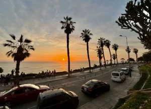 The sunset over the coastline of Lima