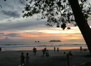 Friends hanging out together on the beach in Costa Rica